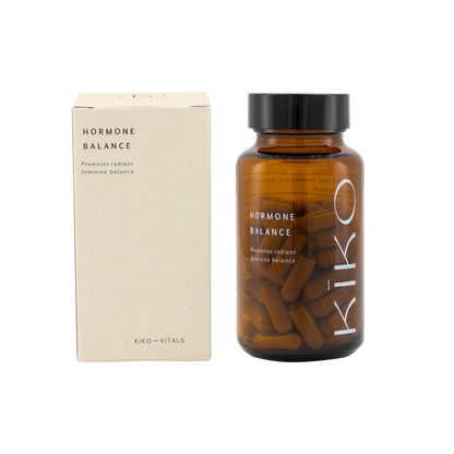 Brown supplement bottle with 'Kiko' branding and beige box labeled 'Hormone Balance' on a white background