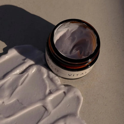 Kiko Vitals Sacred Moon Balm with cream on a textured surface
